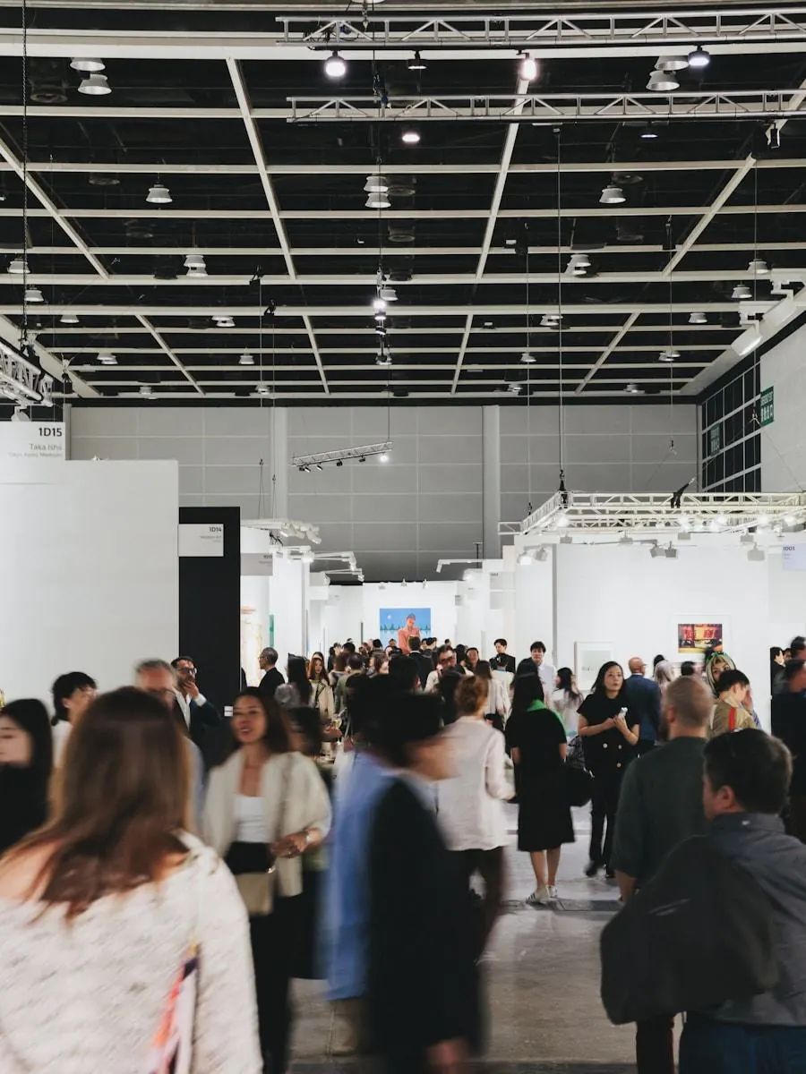 Visitors moving through a busy international exhibition hall