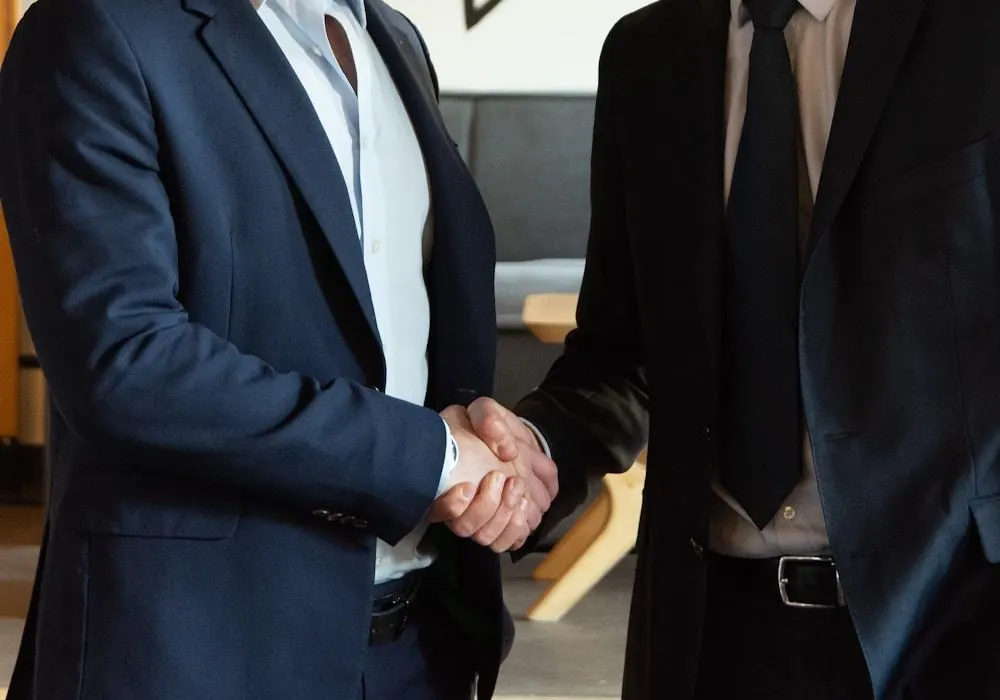 Two business people shaking hands