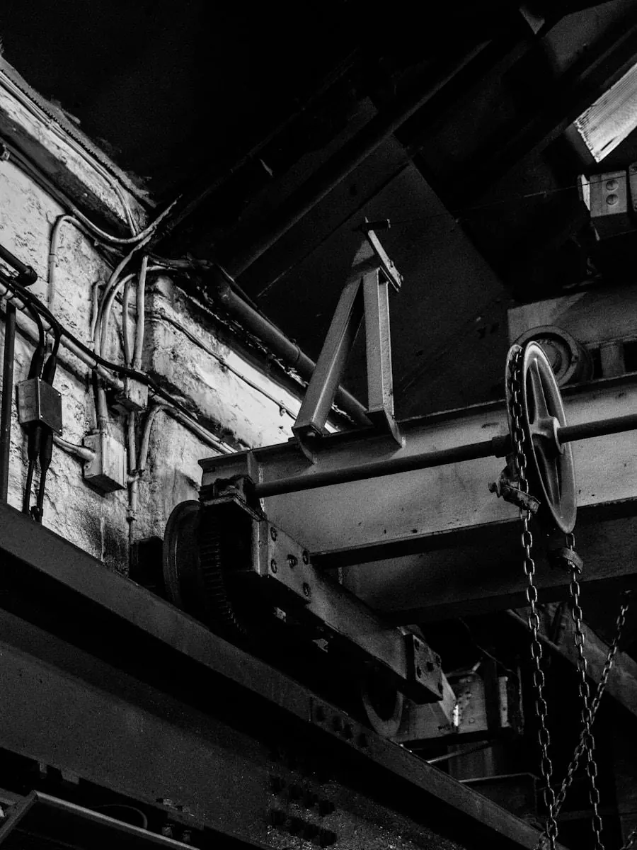 Overhead pulley and chain machinery in a factory