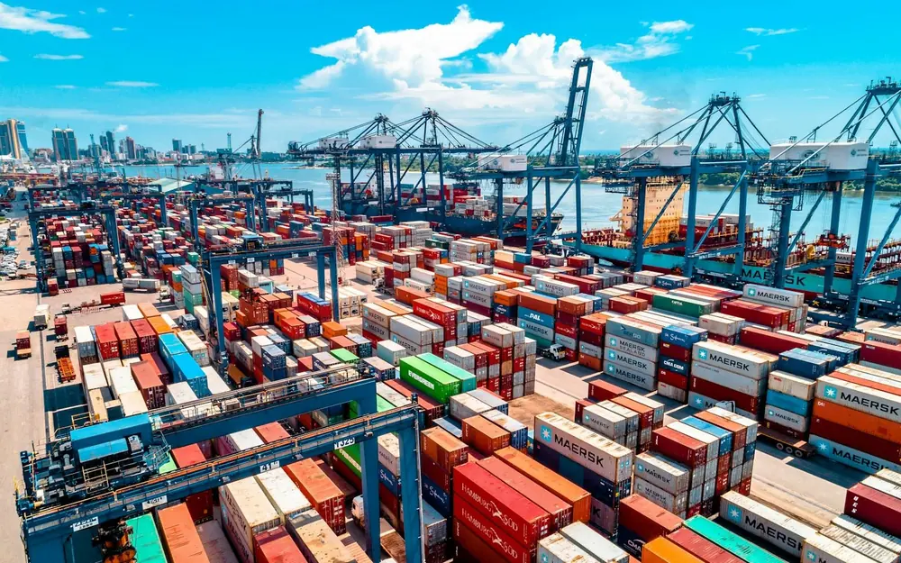Aerial view of a container port with cranes