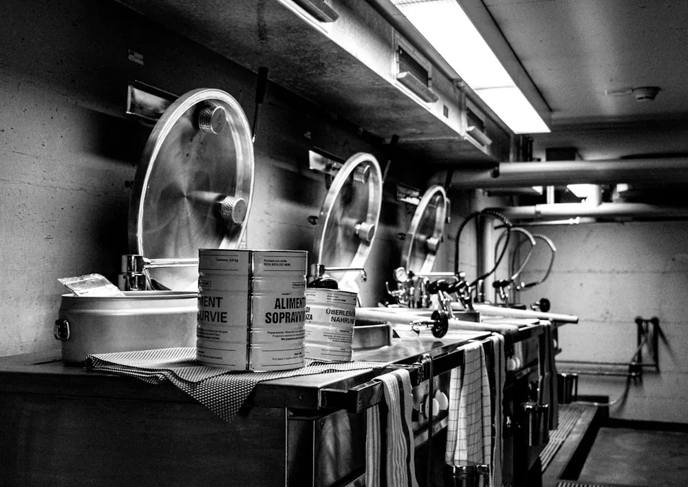 Production kitchen with steel vats and ingredient tins